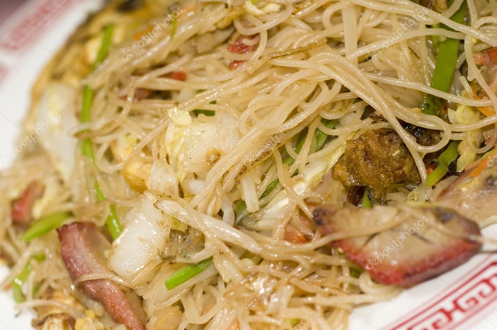 Chinese thin rice noodles flat with sliced roast pork — Stock Photo