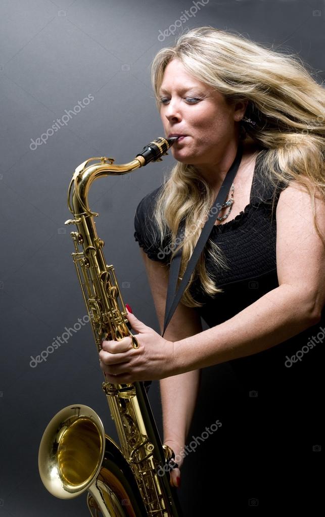 Sexy blond female saxophone player musician — Stock Photo © rjlerich