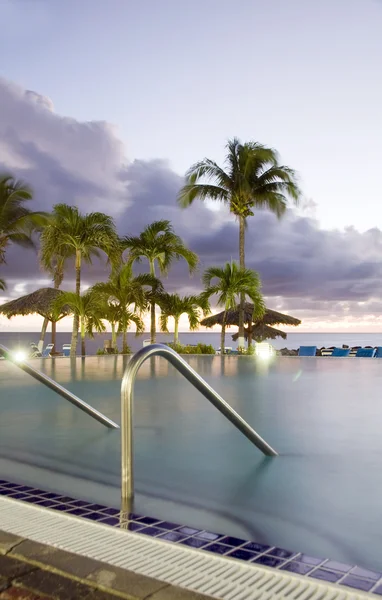 Large luxury infinity swimming pool dusk sundown hotel St. Maarten St. Martin Caribbean Island
