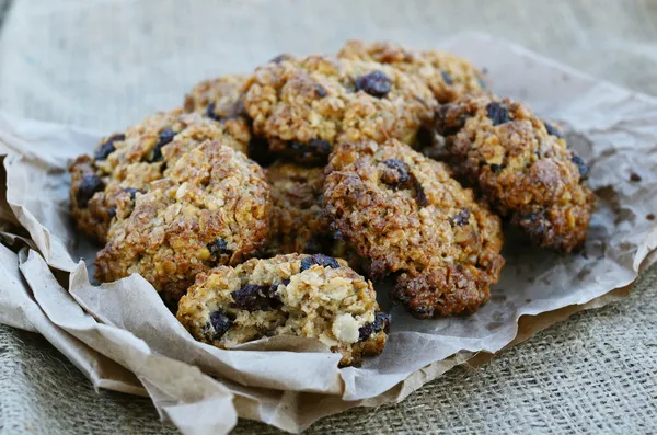 Homemade oatmeal cookies on canvas background