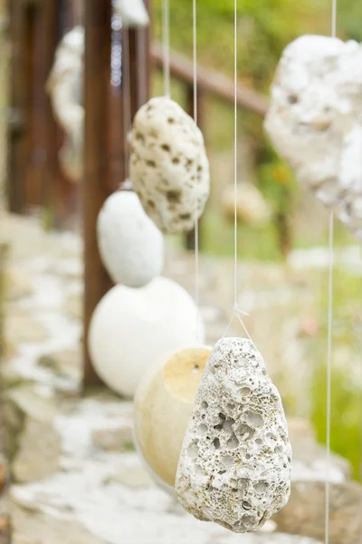Wooden railing with hanged stones