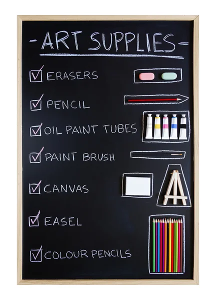 Art supplies over blackboard background