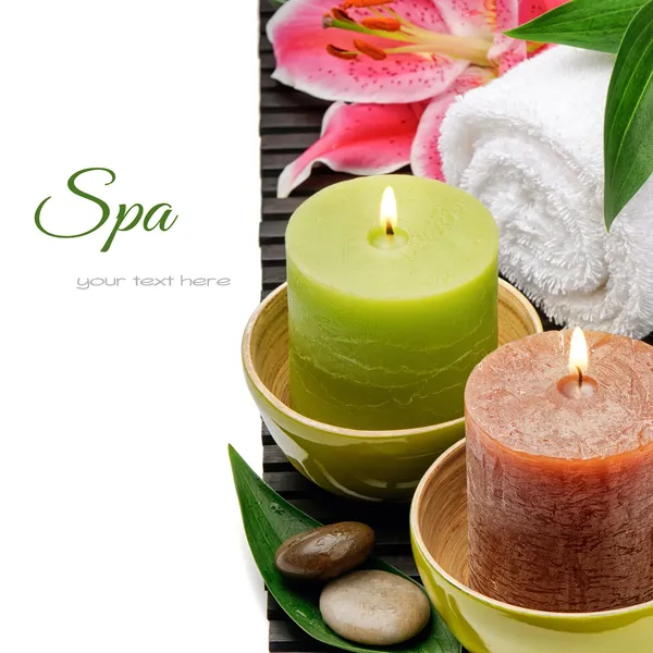 Spa setting with candles and lily