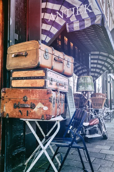 Antiques shop with vintage travel suitcases