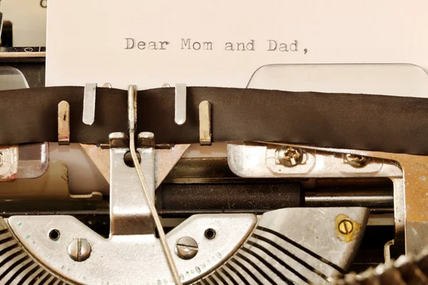 Text Dear Mom and Dad typed on old typewriter