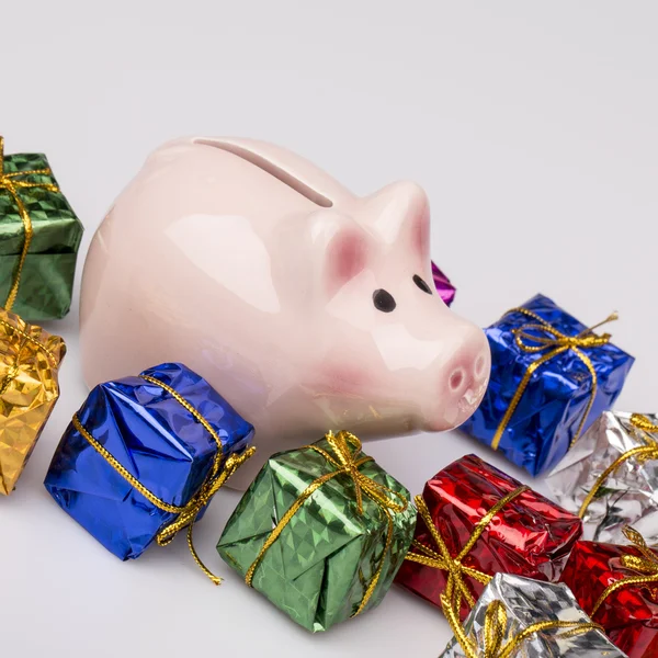 Pig money box between christmas gift