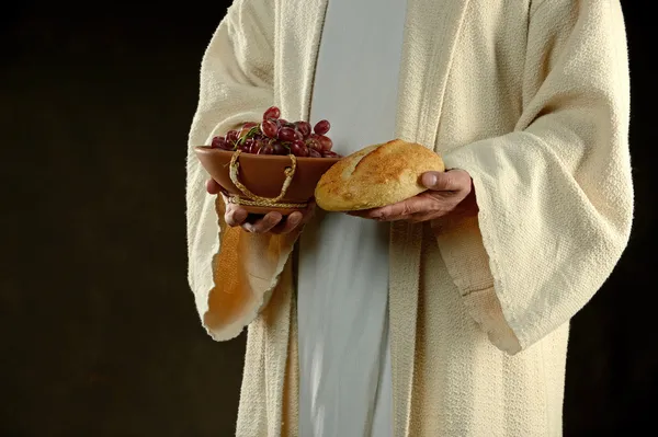 Jesus Holding bresd and grapes