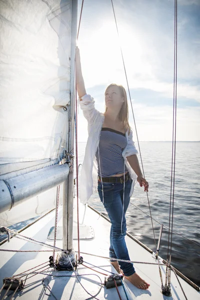 Woman staying on sailboat