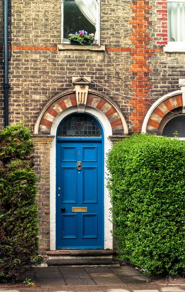 Arched blue door of victorian english house, UK