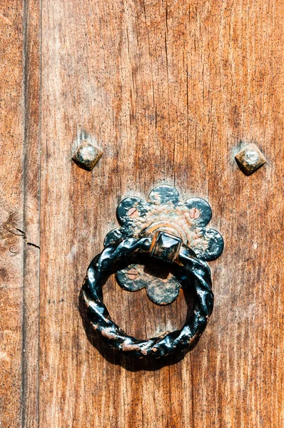 Door knocker and rustic door close up