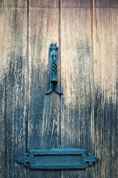 Door knocker and vintage door for use as a background