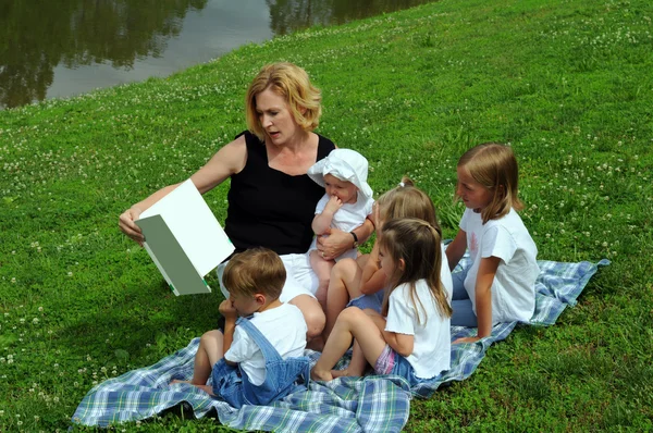 Mother Reading To Children
