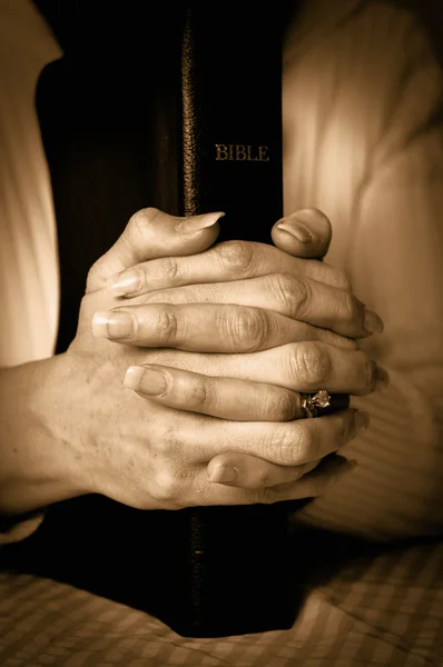 Bible and Hands