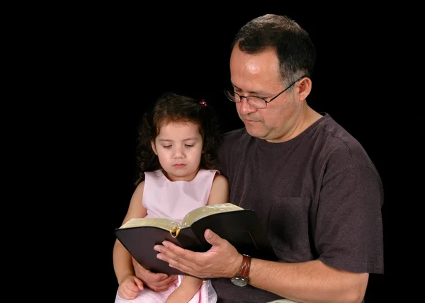 Father Reading Bible To Daughter