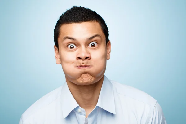 Funny face young man close up portrait