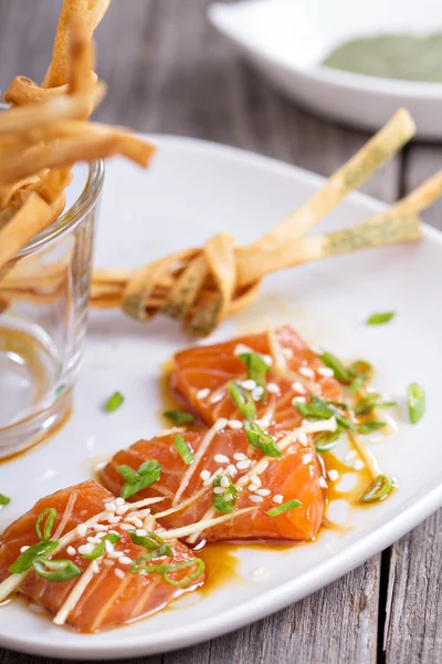 Salmon sashimi with ginger and sesame