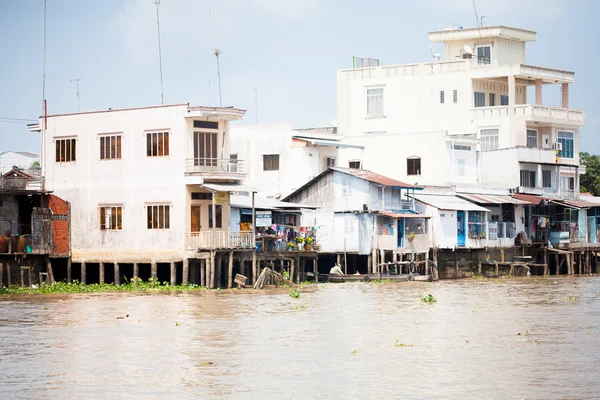 JAN 28 2014 - MY THO, VIETNAM - Houses by a river, on JAN  28, 2