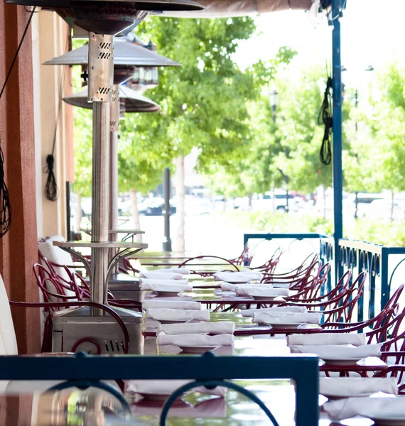 A restaurant with an outdoor seating area.