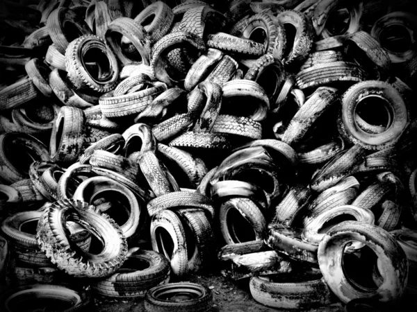 Dozens of old black and white tires
