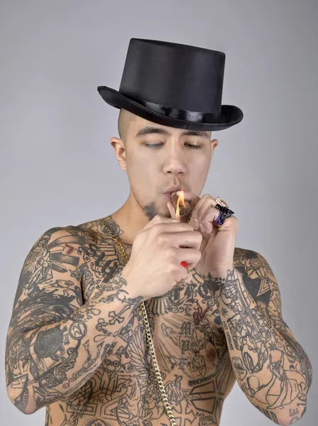 Man with tattoo smoking