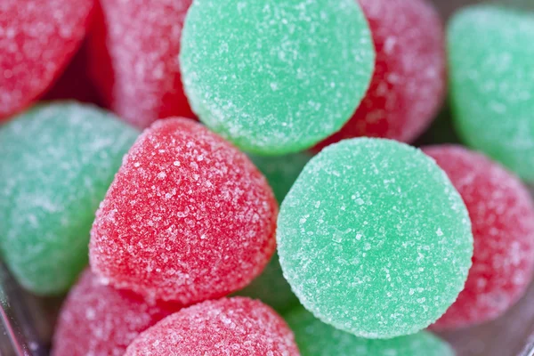 Close up image of red and green sugar candy