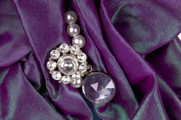 Gemstone in purple fabric