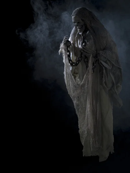 Image of a human skeleton surrounded with smoke