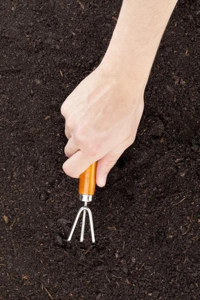 Cultivating soil