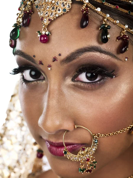 Attractive young female wearing wedding jewelry