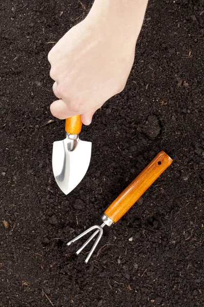 Digging soil close up