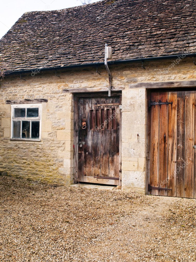 Pietra garage con porta vecchia — foto stock © kozzi2 #18825457 Garage di legno