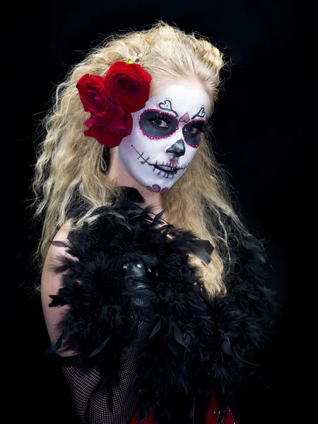 Scary looking woman wearing roses and face make up — Stock Photo #19353511