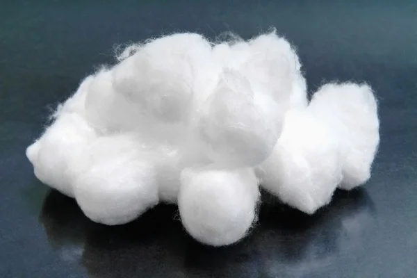 Soft white fluffy cotton balls isolated on dark background cosmetic medical health care healthcare pads
