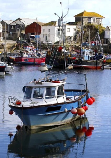 Colorful fishing boats at anchor in Mevagissey fishing village