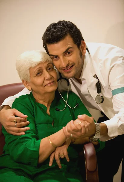 Doctor comforting patient