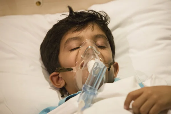 Boy with oxygen mask