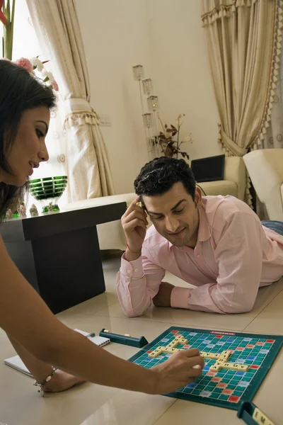 Couple playing scrabble