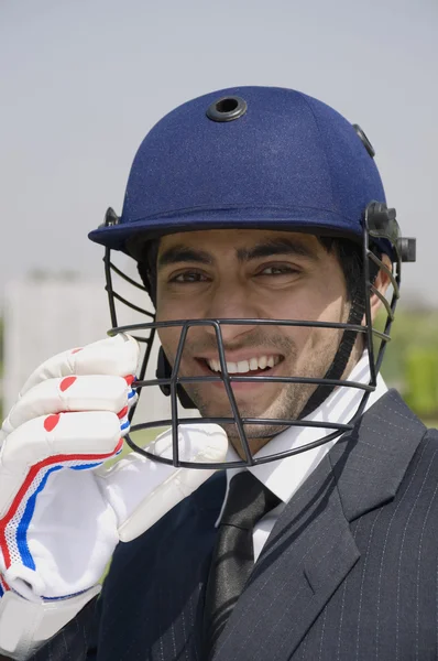 Executive in cricket helmet