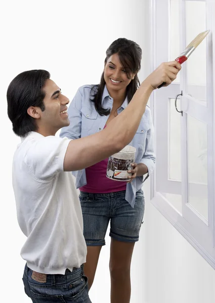 Couple having fun with paint