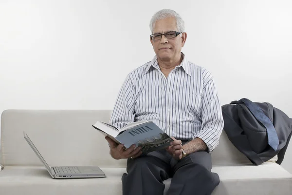 Old man reading a book