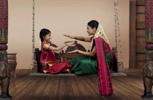 Woman playing with her daughter