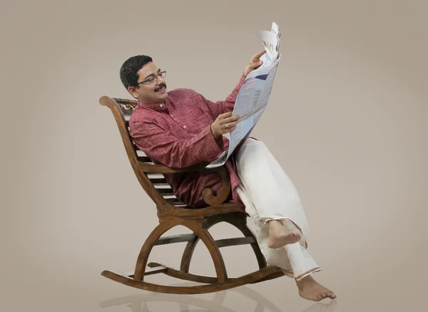 South Indian man sitting on a chair