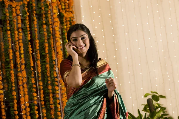 South Indian woman talking on a mobile phone