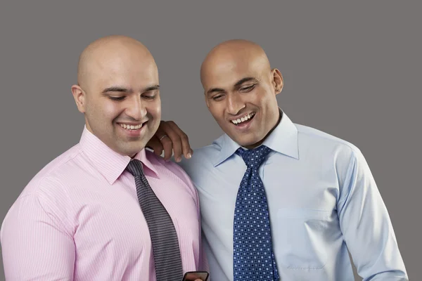 Two bald executives