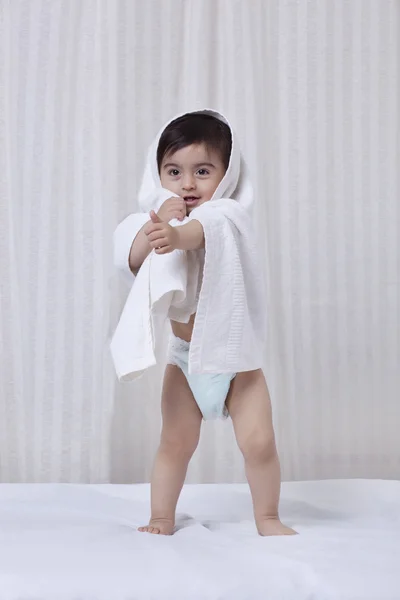 Little boy with a towel