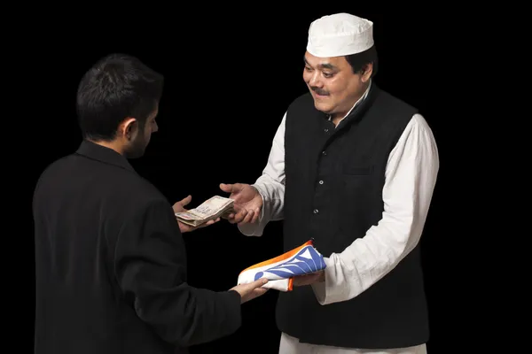Male politician taking a bribe