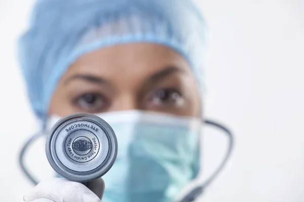 Female doctor holding stethoscope