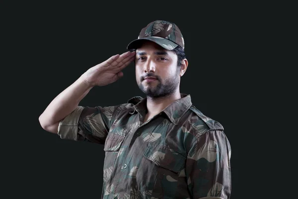 Male military soldier saluting