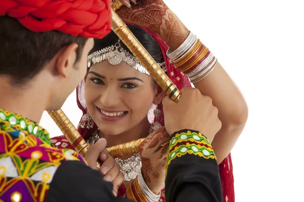 Couple with sticks dancing