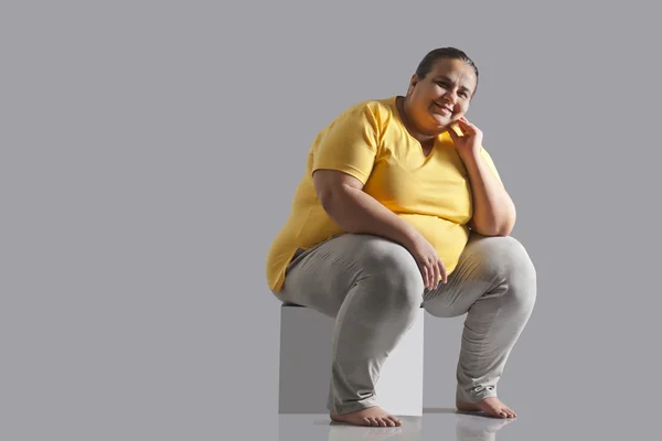 Portrait of an obese woman sitting